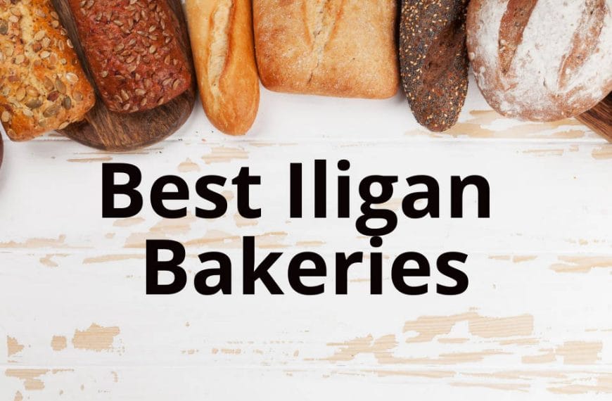 Assorted breads on a white wooden surface with Best Iligan City Bakeries text overlay.