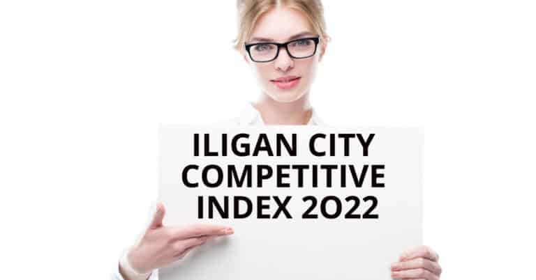 Person holding a sign that reads ILIGAN CITY COMPETITIVE INDEX 2022 against a white backdrop. #IliganCity.