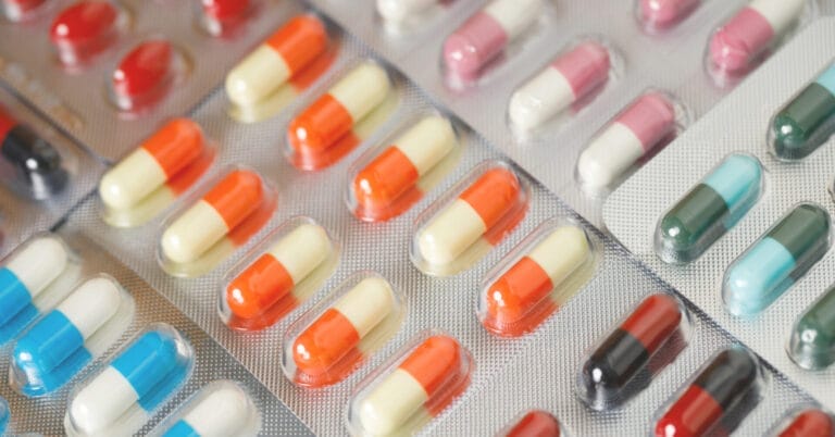 blister packs of multicolored capsules displayed diagonally in iligan citys pharmacies.