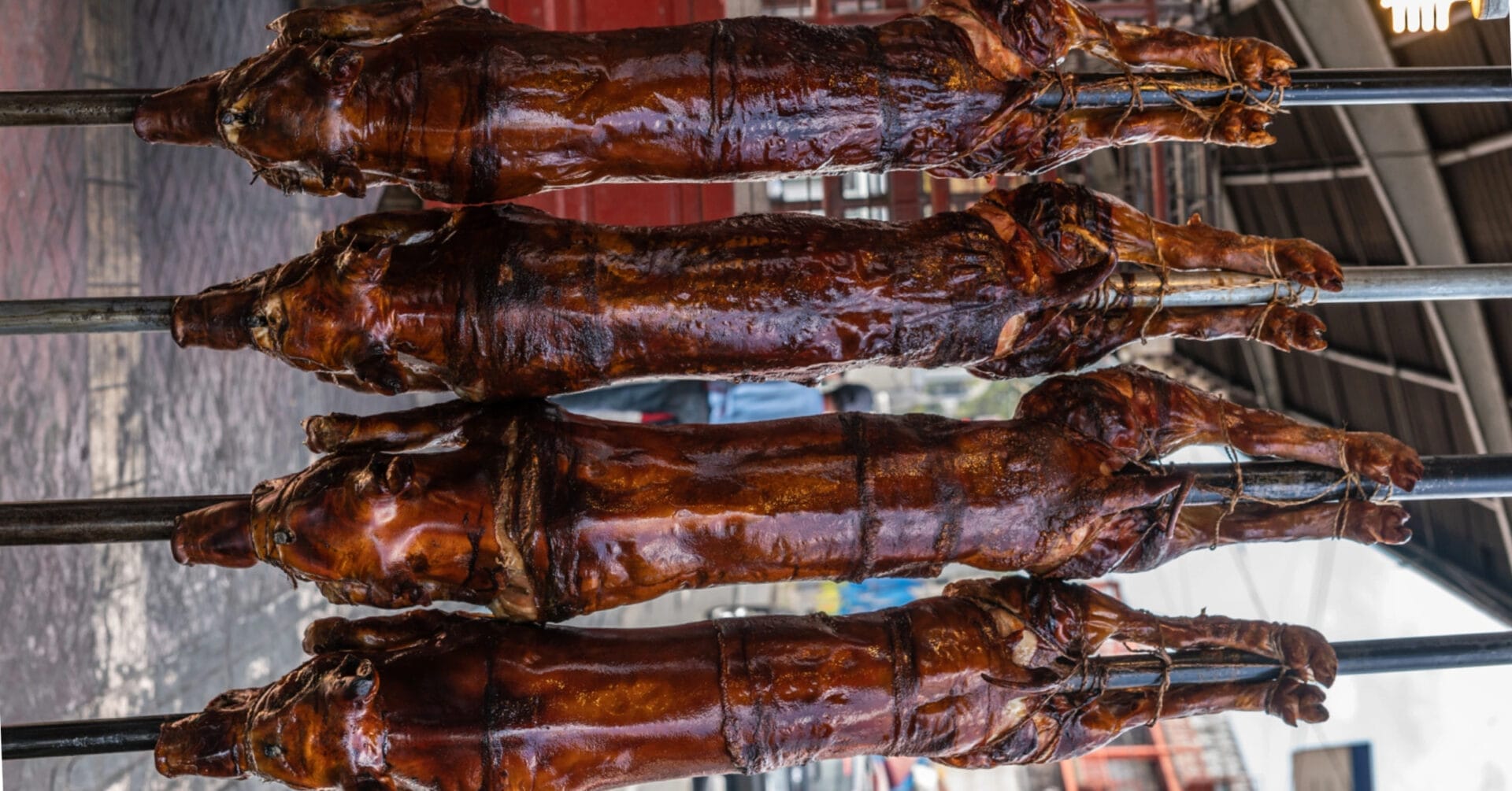 four whole roasted pigs on spits a must see among things to do near iligan citys majestic waterfalls