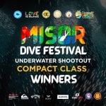 colorful misor dive festival underwater shootout compact winners text over a dark underwater fish background.